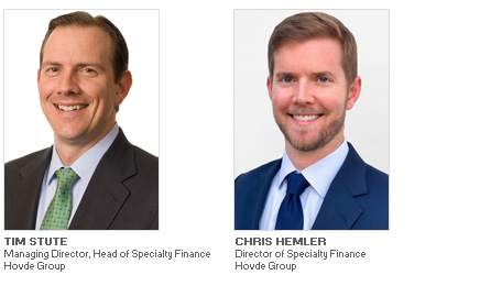 Photos of Tim Stute and Chris Hemler of Hovde Group discussing Equipment Finance Advisor